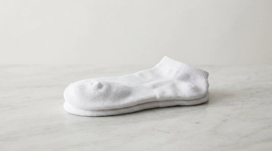 Premium white ankle socks with cushioned footbed and low-cut silhouette for everyday wear