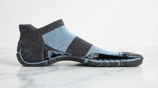 Cross-section view of a premium sock showing reinforced heel arch support band and seamless toe