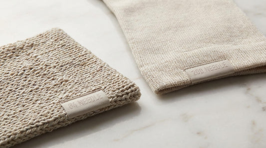Extreme close-up of two sock fabrics side by side showing 84 needle versus 200 needle density difference