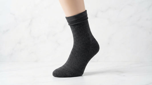Dress sock shown mid-calf with visible grip technology at the inner calf demonstrating stay-up engineering