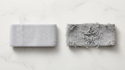 Close-up of stretched elastic cuff showing fiber degradation versus a new elastic cuff