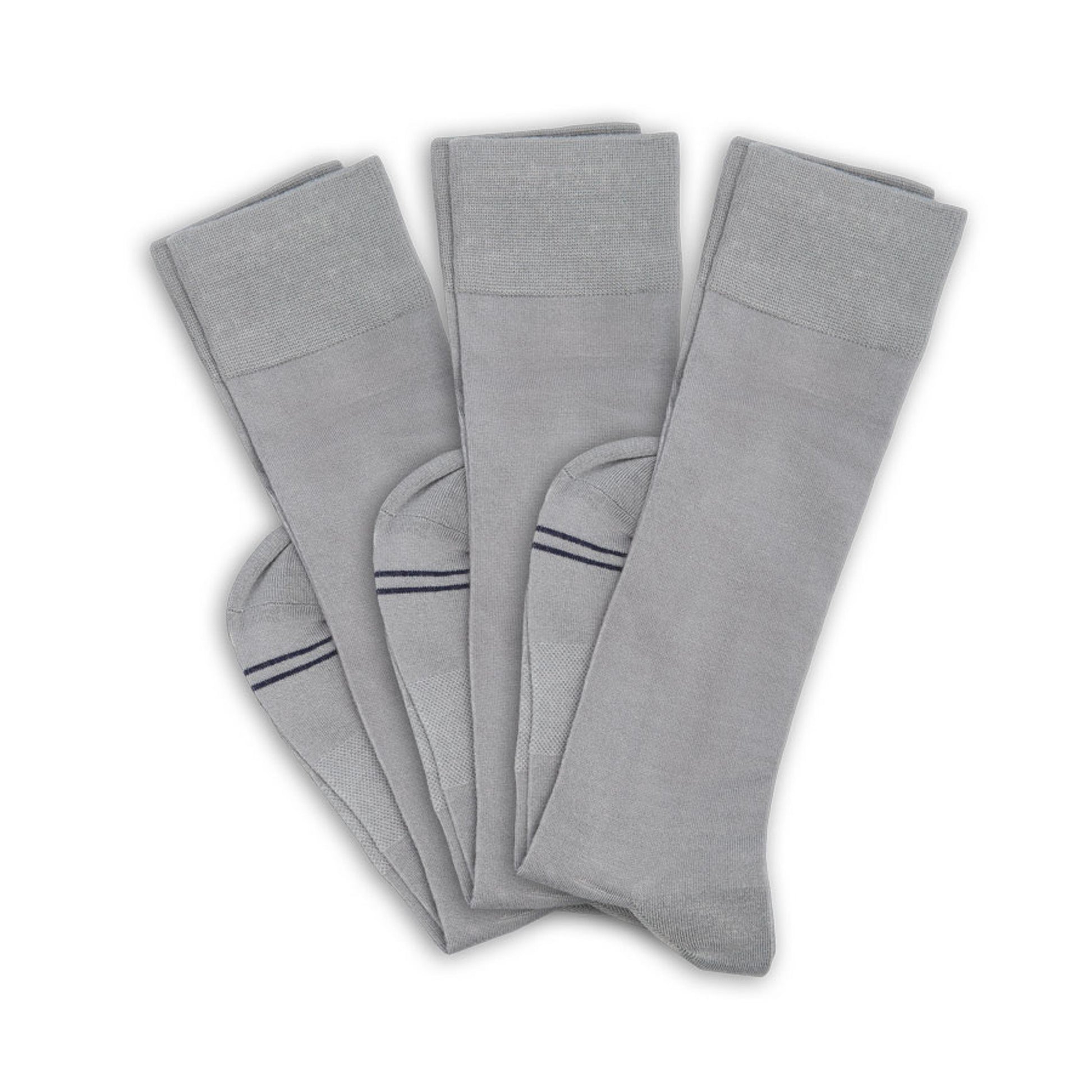 3 grey socks folded at ankle and layered on top of one another