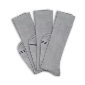 3 grey socks folded at ankle and layered on top of one another