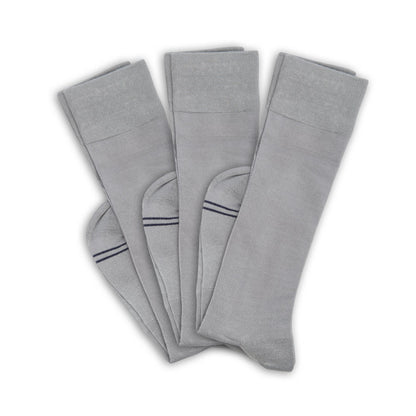 3 grey socks folded at ankle and layered on top of one another