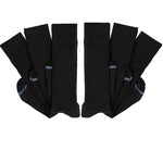 6 pairs of black socks folded at ankle and layered on top of one another