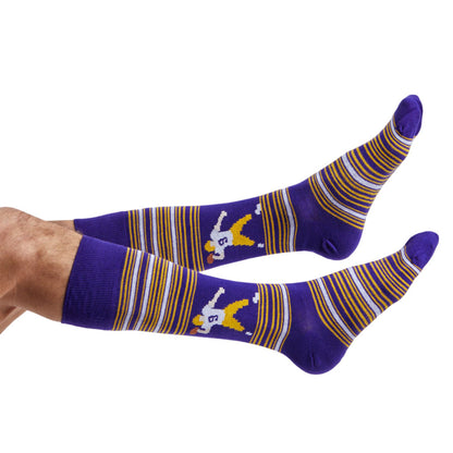 Purple and gold dress socks with a 8-bit JoeyB football player on the ankle shown on legs coming into the left side of the image