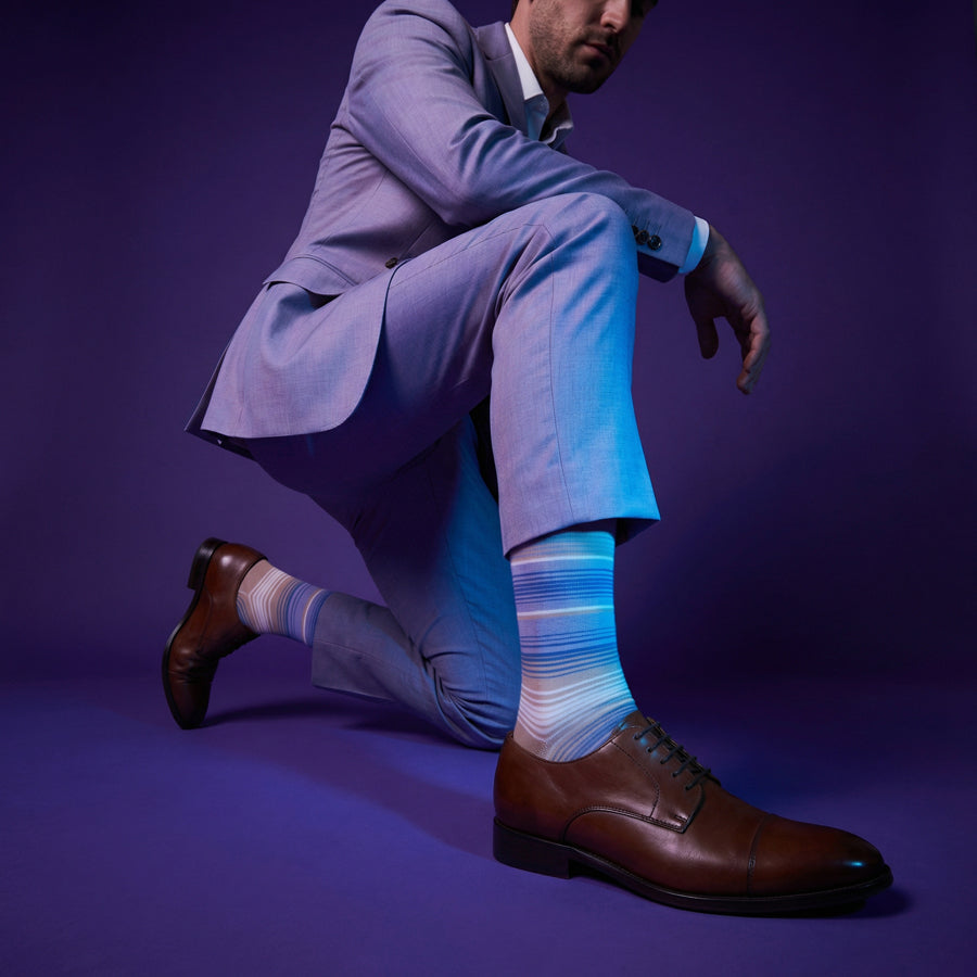 Allen lavender and blue stripe dress socks under neon lighting