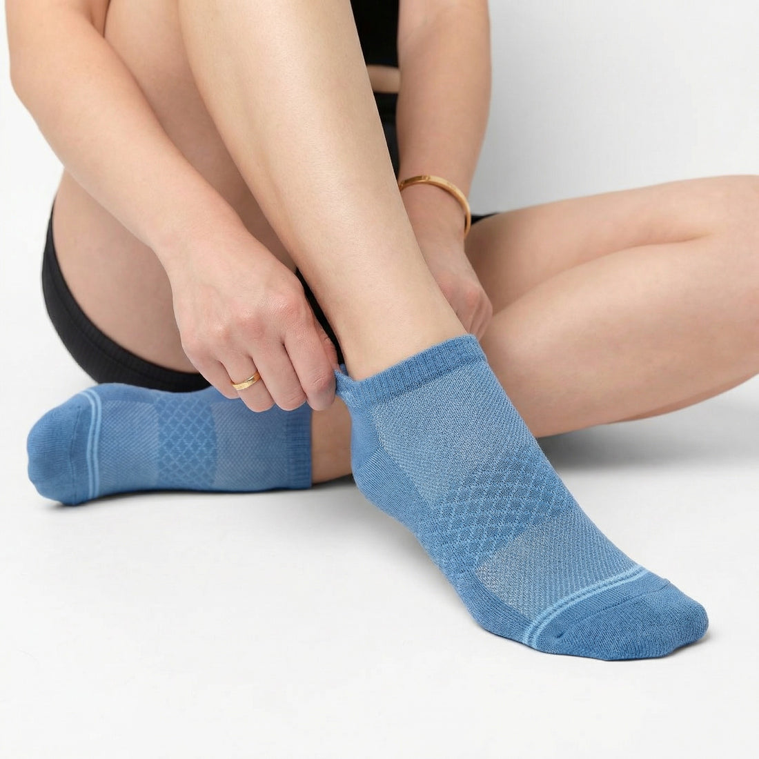 Blue ankle socks on woman with mesh foot
