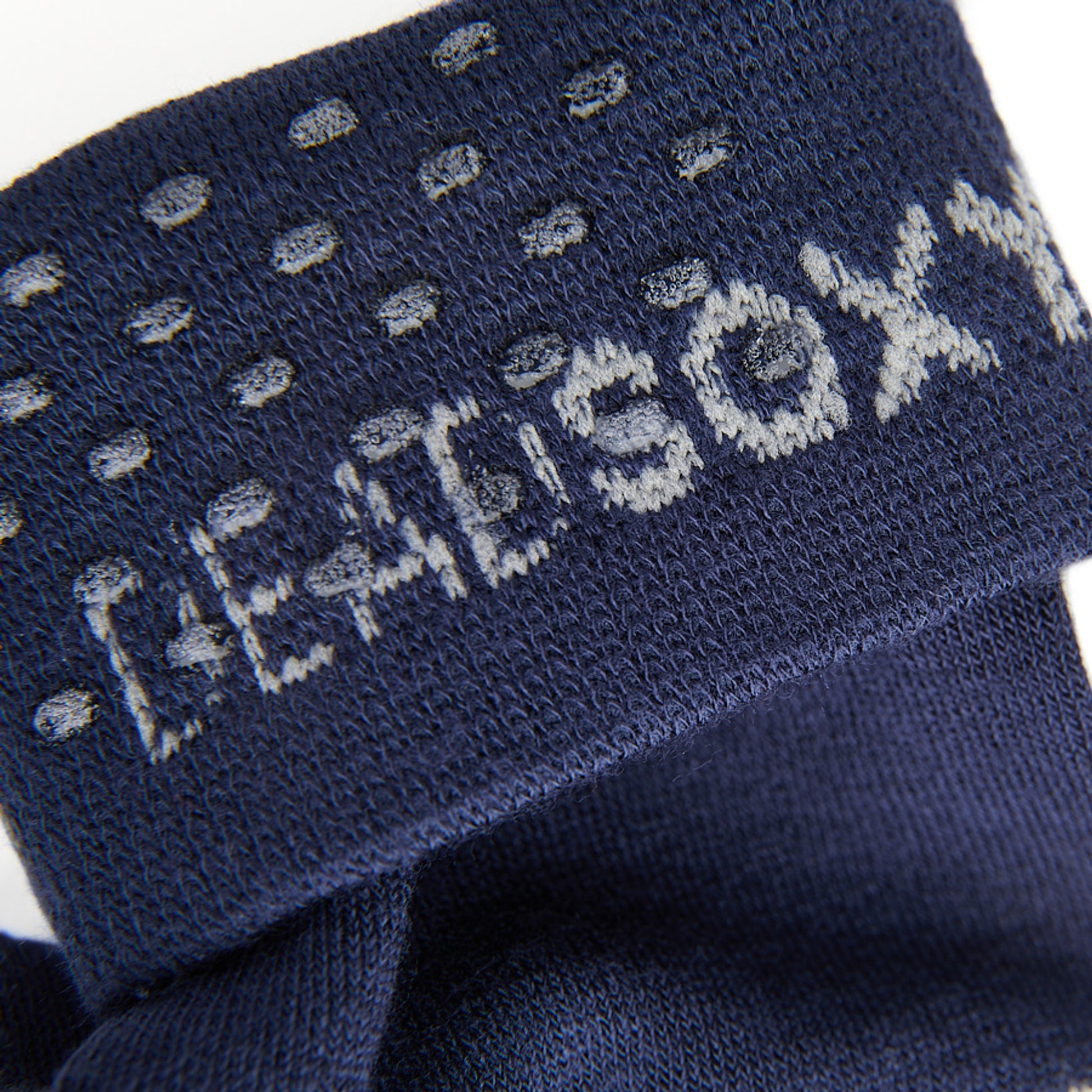 close up view of navy sock welt with TrueStay‚Ñ¢ silicone dots