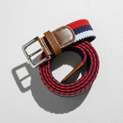 Woven belt with red, white, and blue pattern on a light gray background