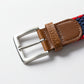 Belt with brown leather buckle and red and blue woven strap on a white background