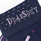 Navy Blue dress socks with green, pink, purple and yellow accents in a patchwork design close up of TrueStay‚Ñ¢ in the welt.