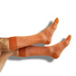 white and burnt orange drip casual socks