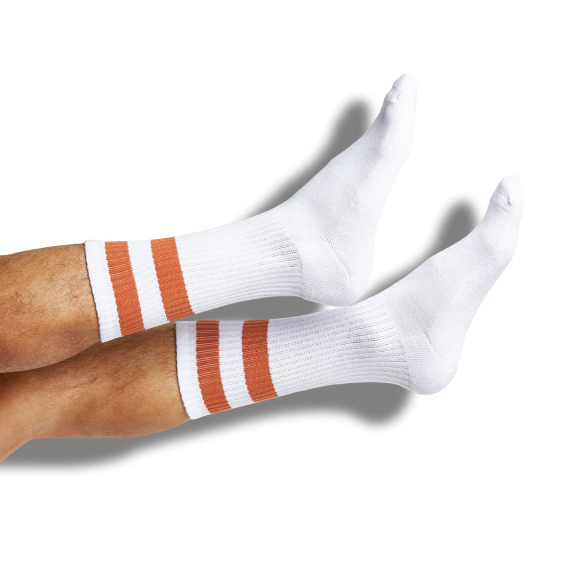 White casual socks with 2 burnt orange retro stripes shown on legs