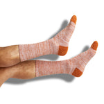 Burnt orange and white marl casual socks shown on legs
