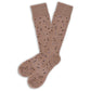 Light brown dress sock with small chicklet triangle designs in navy blue and dark brown.