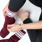 Maroon Retro Howdy Casual Crew Socks with vintage Howdy design adjusting the socks