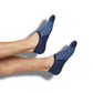 Cooper no-show socks styled on a leg form, showing navy with a blue checkered pattern
