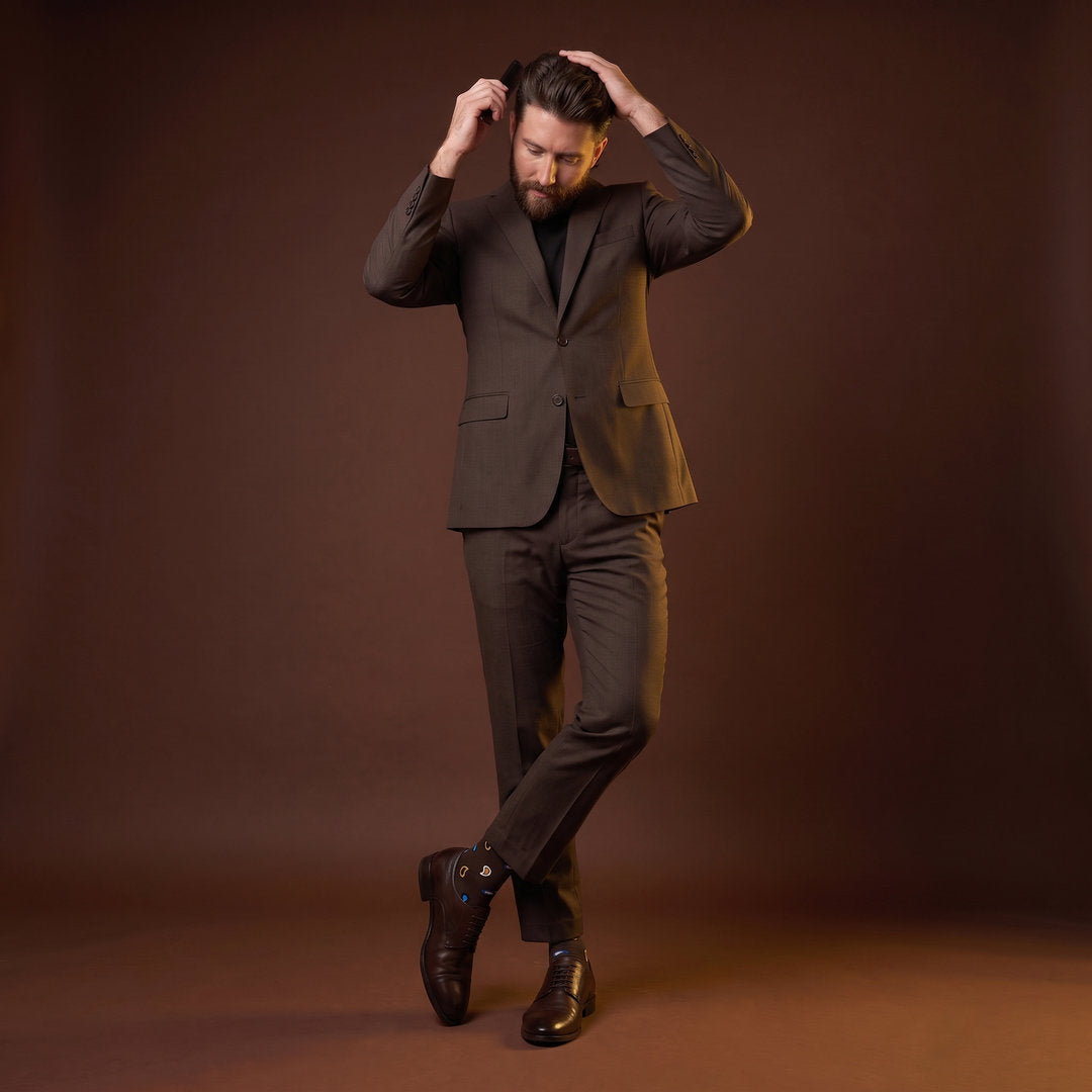 DeadSoxy Briggs cotton dress socks styled with dress shoes in a studio setting