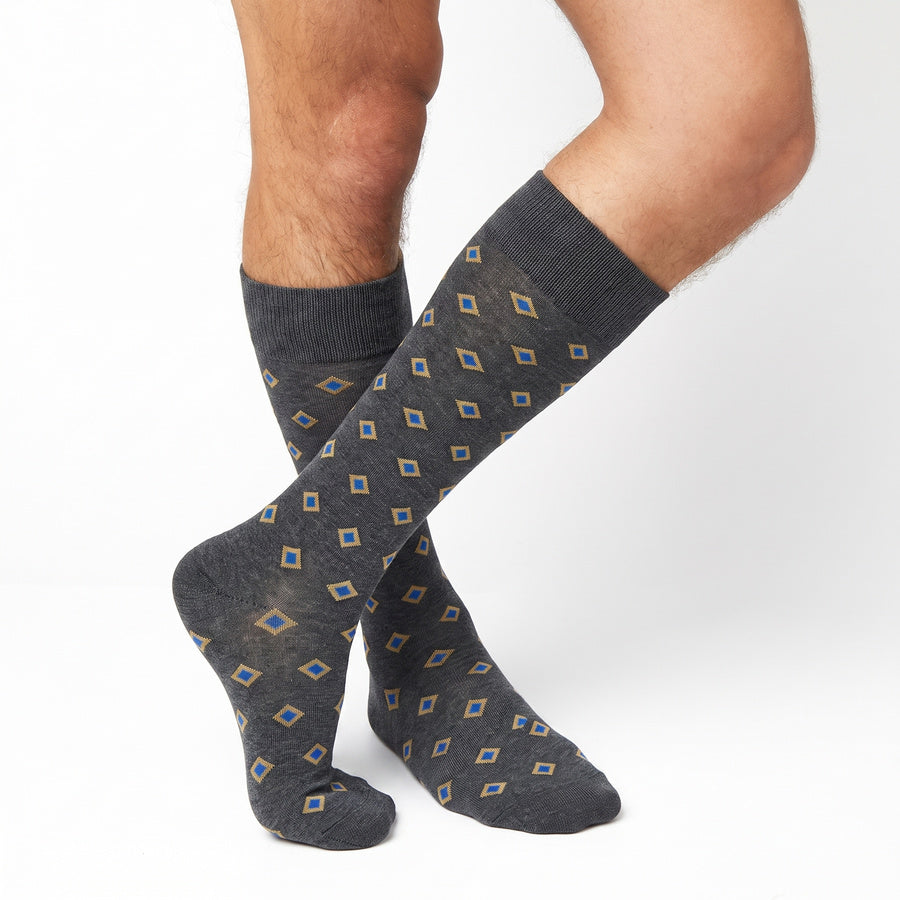DeadSoxy Gerald cotton dress socks worn on leg in an alternate crossed-leg view