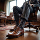 DeadSoxy Gerald cotton dress socks styled with dress shoes in a seated business setting