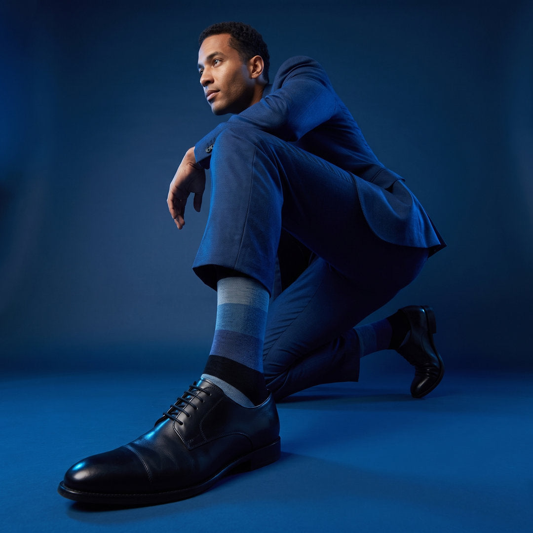 DeadSoxy Irving cotton dress socks styled with dress shoes in a studio setting
