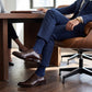 DeadSoxy Knox cotton dress socks styled with dress shoes in a seated business setting
