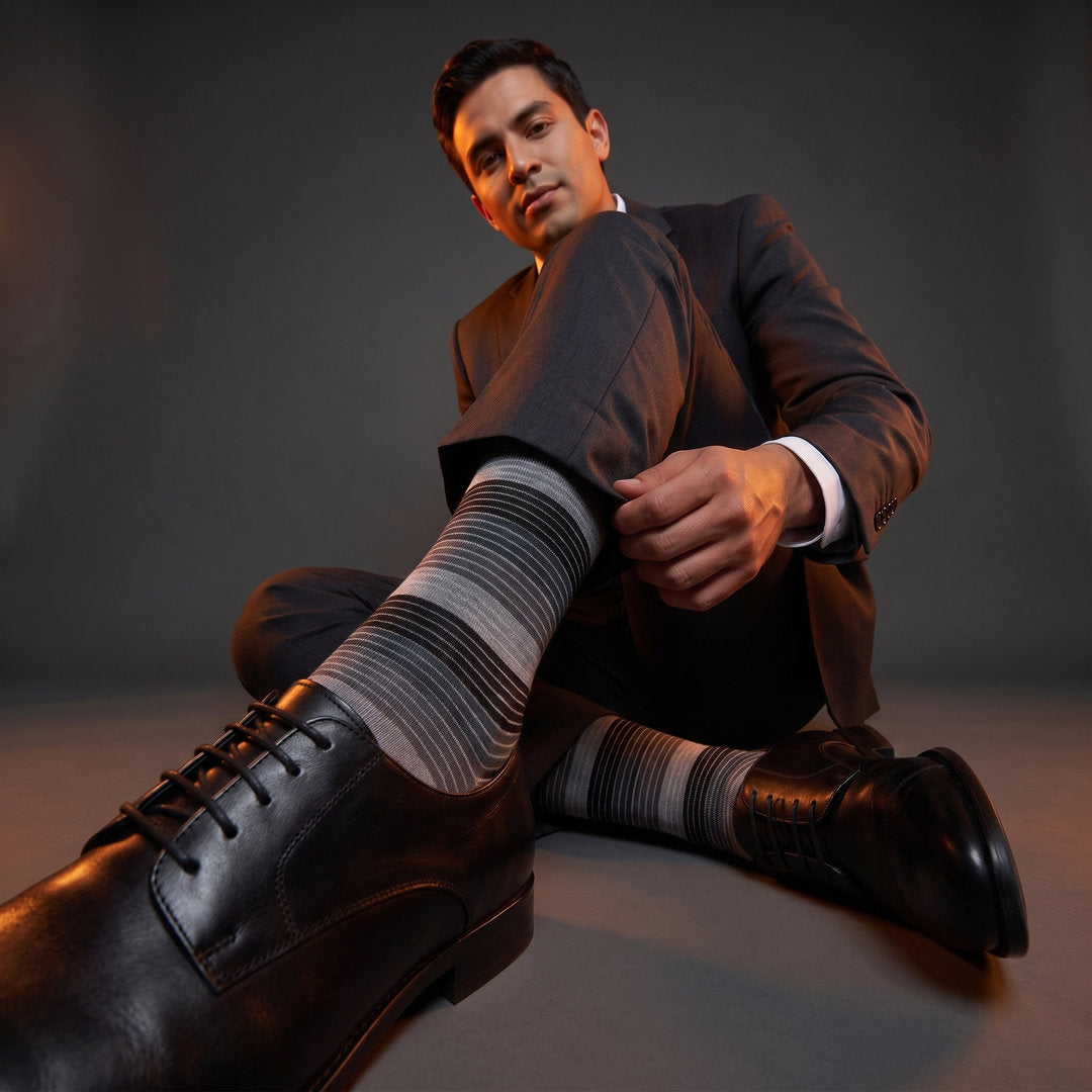DeadSoxy Roman cotton dress socks styled with dress shoes in a studio setting