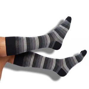 DeadSoxy Roman cotton dress socks worn on leg, showing the Fall 2026 pattern and fit
