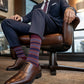 DeadSoxy Sampson cotton dress socks styled with dress shoes in a seated business setting