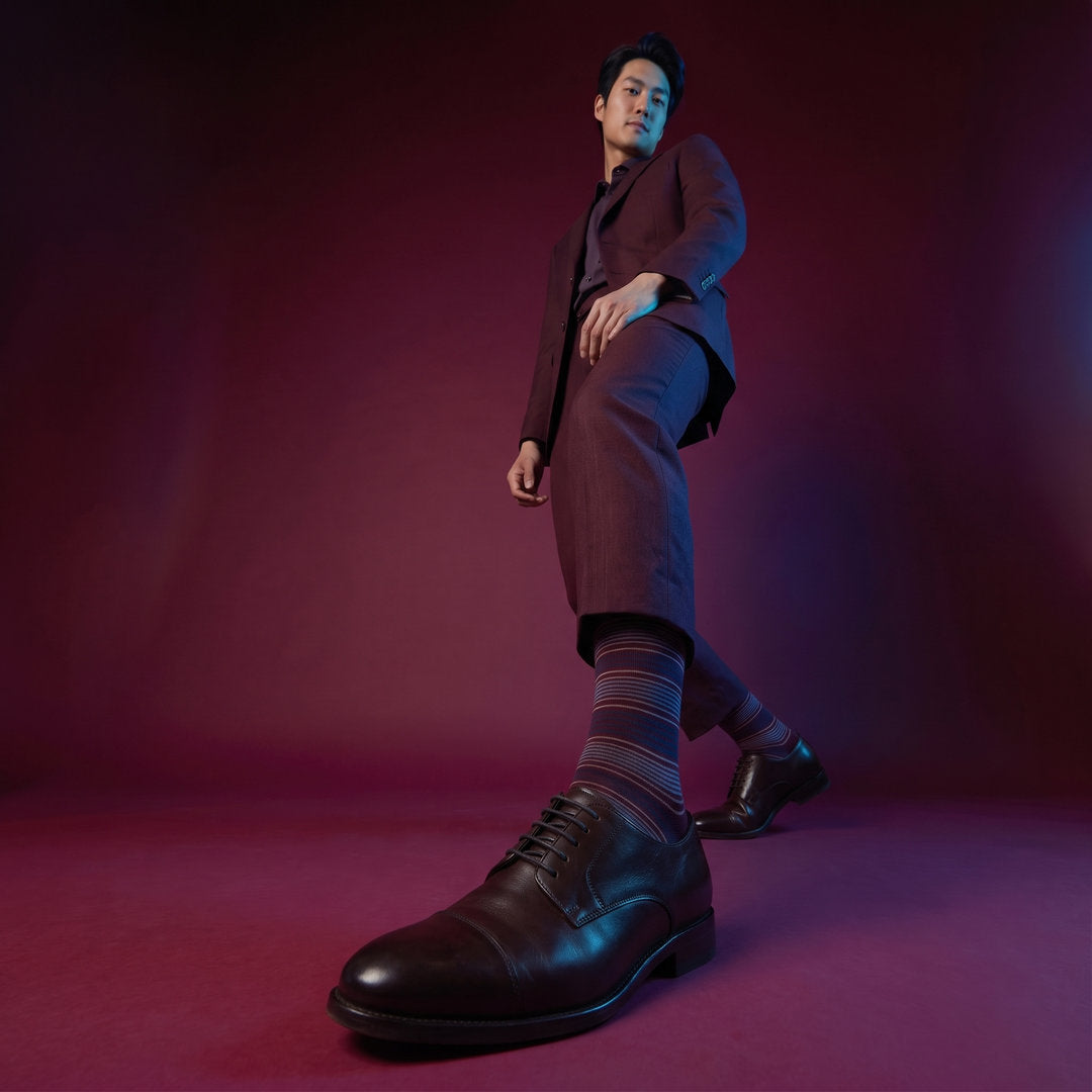 DeadSoxy Sampson cotton dress socks styled with dress shoes in a studio setting