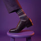 DeadSoxy Smith cotton dress socks styled with dress shoes in a studio setting