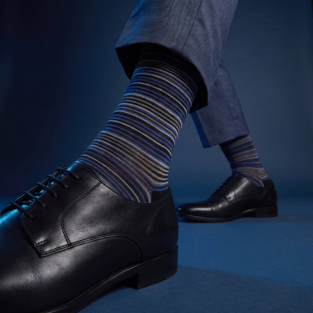 DeadSoxy Zane cotton dress socks styled with dress shoes in a studio setting