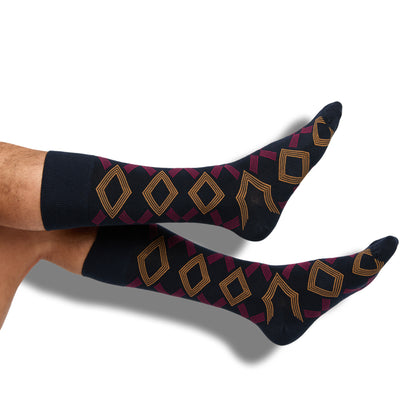 Navy dress socks with yellow and red geometric design on the leg
