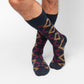 Navy dress socks with yellow and red geometric design on the leg