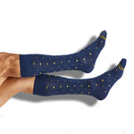 Navy dress socks with gold dots and a gold accent stripe on the toe shown on legs