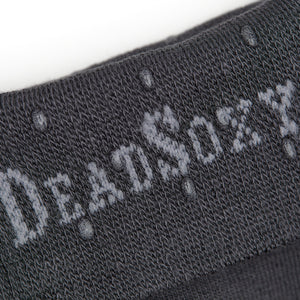 Close up shot of charcoal sock welt featuring clear silicone dots