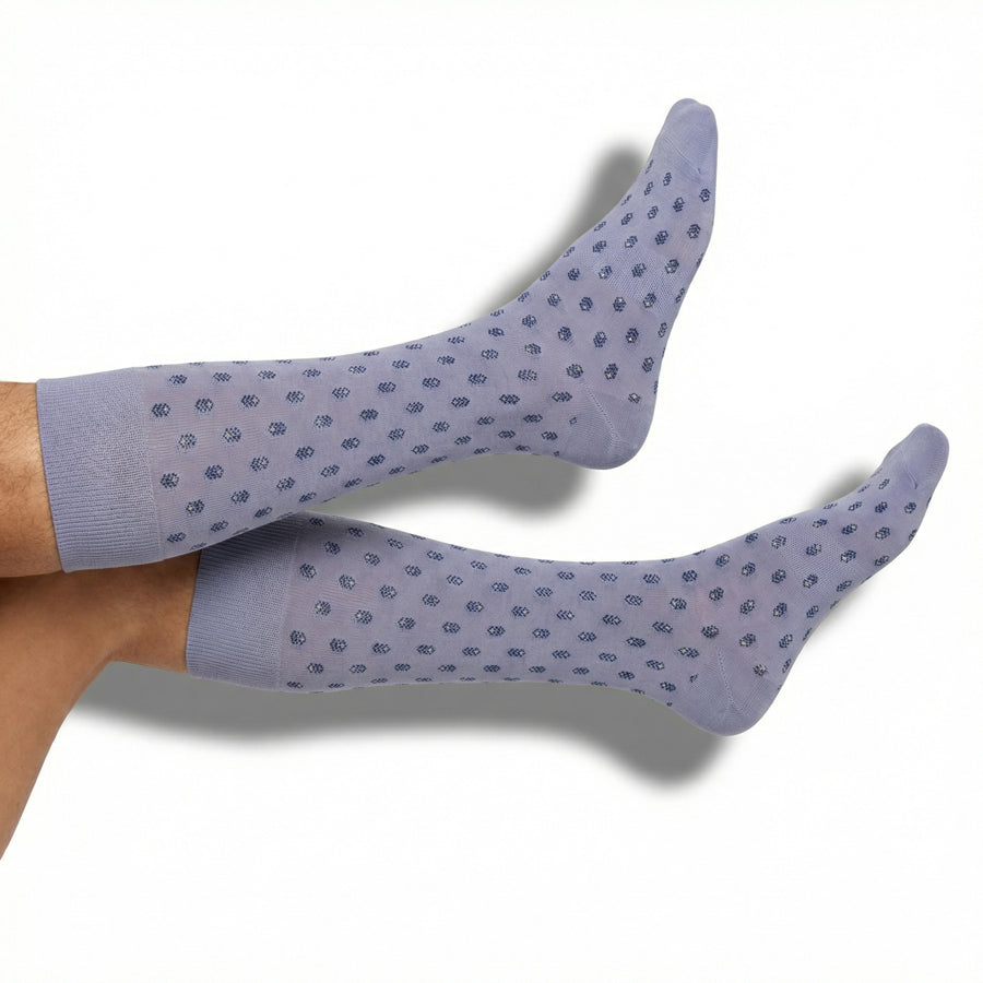 DeadSoxy Emmett dress socks in lavender micro-geometric pattern worn on foot