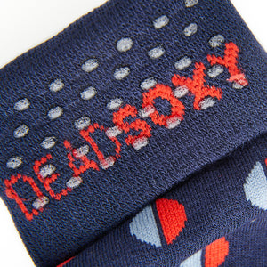 Close up view of navy blue dress sock welt with TrueStay‚Ñ¢ silicone dots.
