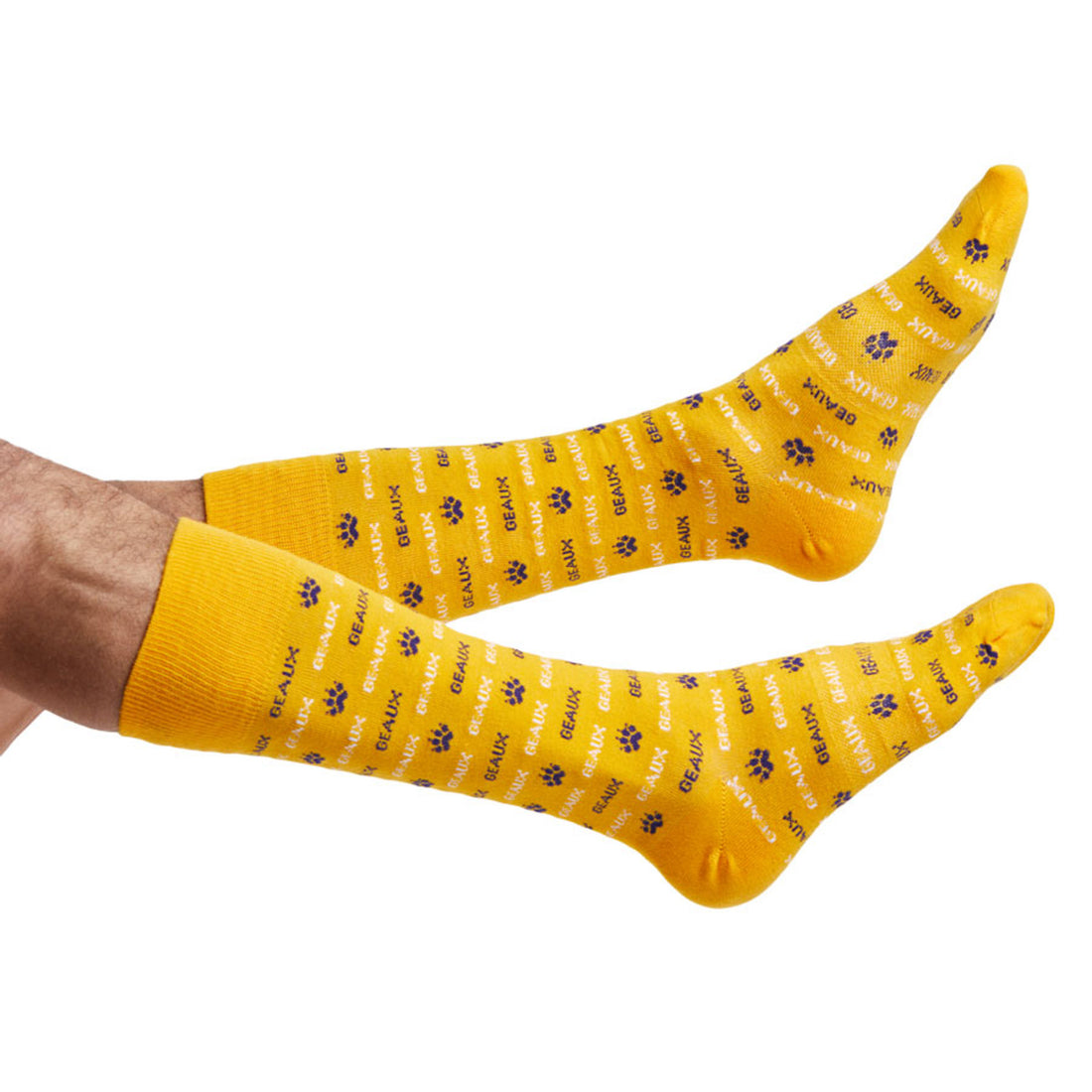 Gold dress socks with a the word GEAUX written in purple and a tiger print as stripes shown on legs coming into the left side of the image