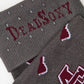 MSU Gray Cowbell Dress socks close welt and cuff detail, showing scattered maroon cowbells and the interlocking MSU logo on charcoal