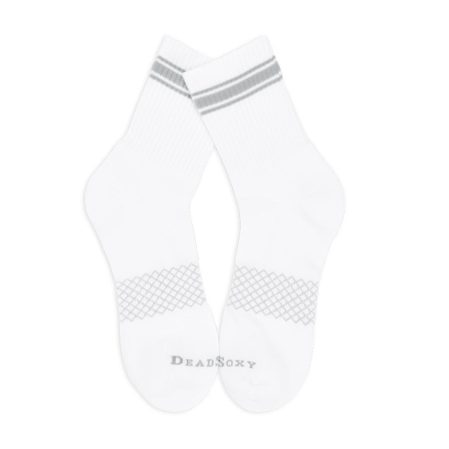 Flat-lay image of white and grey women’s quarter crew socks showing ribbing and reinforced heel.