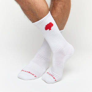 White casual crew socks with The Grove Collective logo on the calf.
