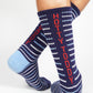 Navy athletic casual  Ole Miss licensed socks with stripes in red and powder blue with Hotty Toddy going down the back of the leg.