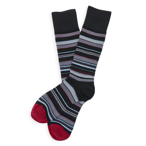 Black and white striped Jett dress sock laid flat showing full pattern and construction details.