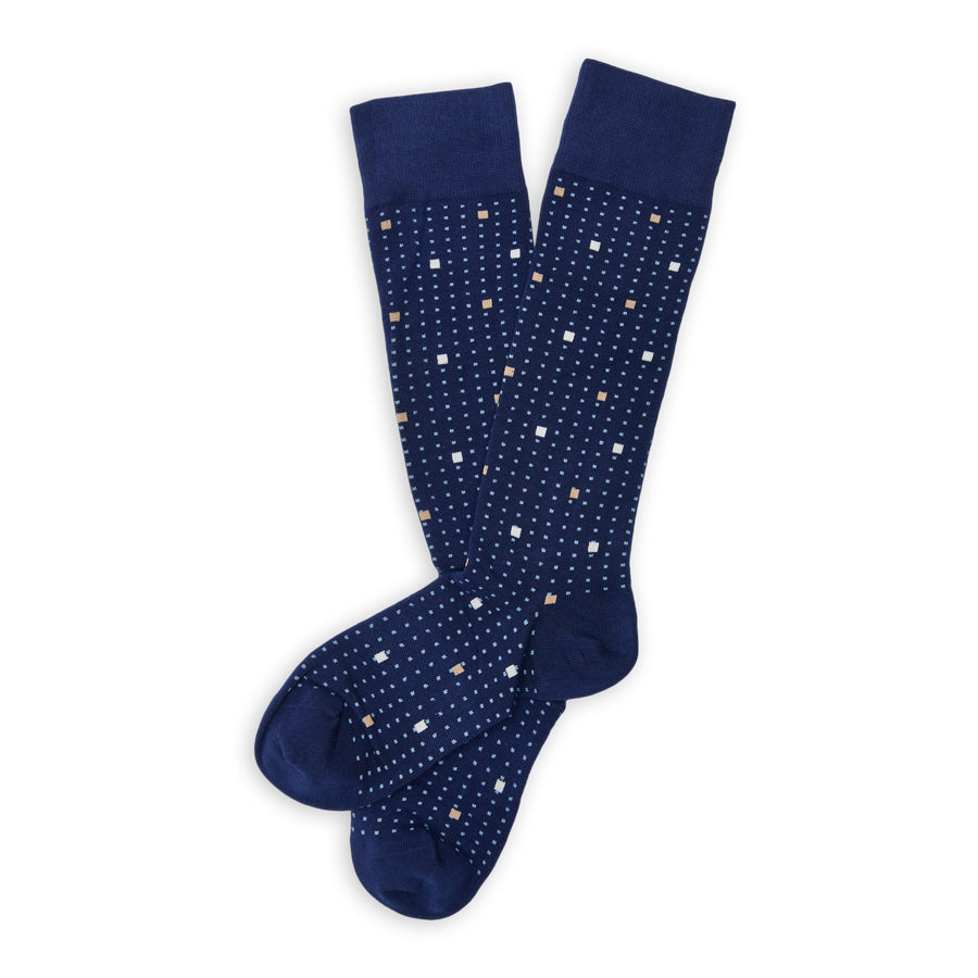 DeadSoxy Knox Cotton Dress Socks flat lay showing a navy base with small blue, cream and white square motifs