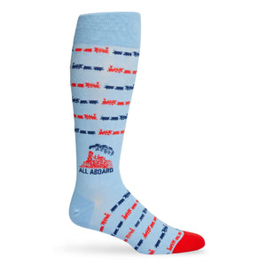 Powder Blue dress socks with trains and text saying ALL ABOARD the lane train shown on a mannequin