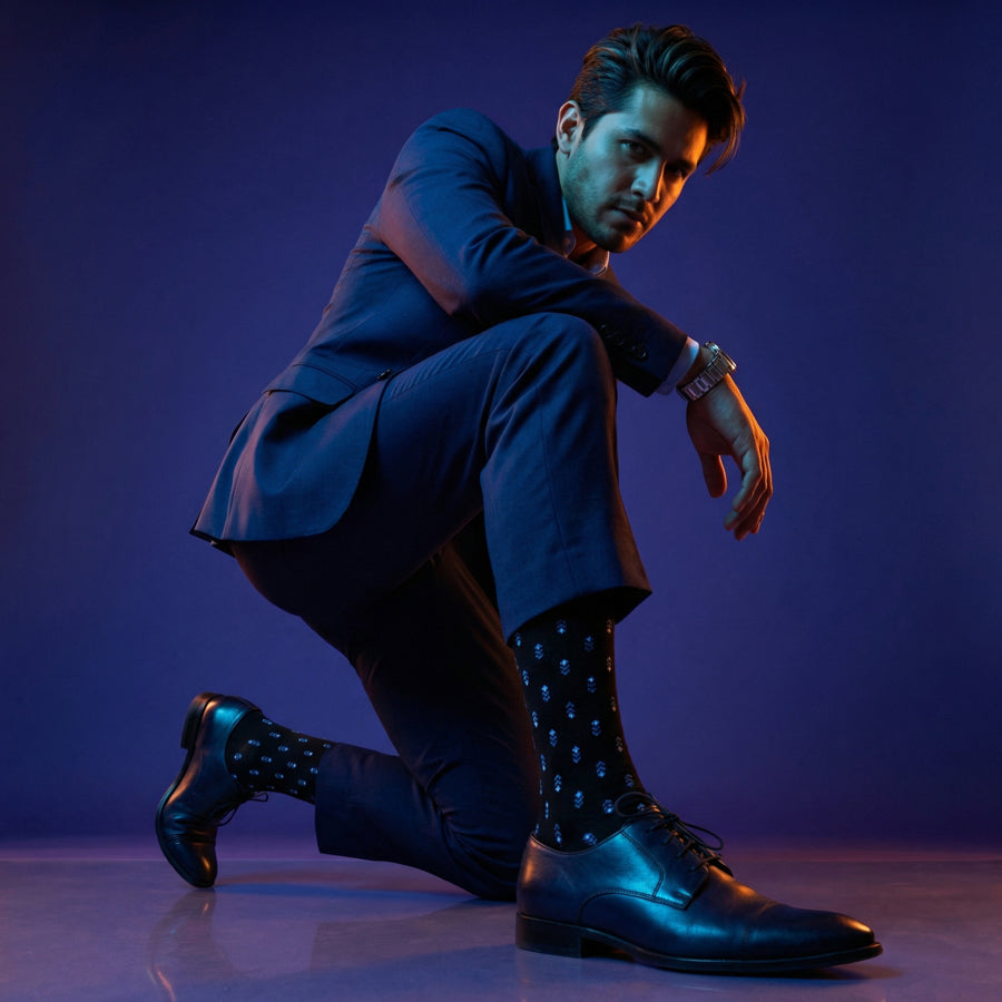 Lloyd black and steel blue dress socks under neon lighting
