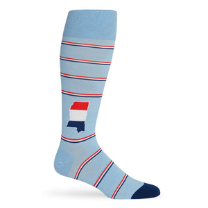 Powder blue dress socks with the state of Mississippi on the ankle and 3 color stripes red, navy, and white shown on a mannequin
