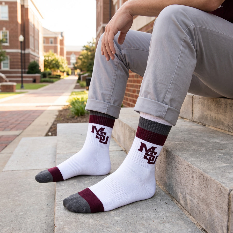 MSU Retro Stripe Casual socks worn without shoes, showing maroon and gray banding with the interlocking MSU logo on white